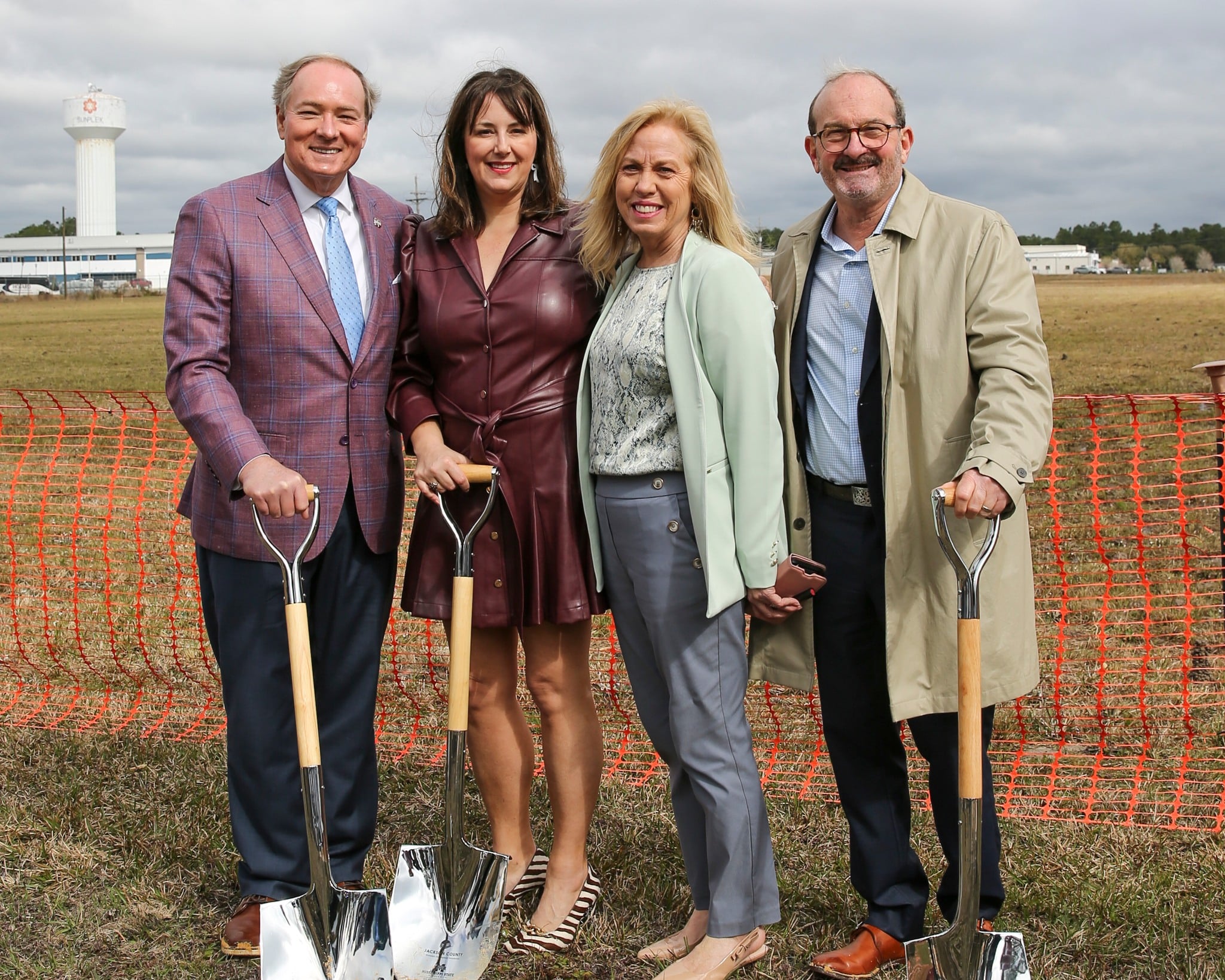 Two men sitting in a control room.